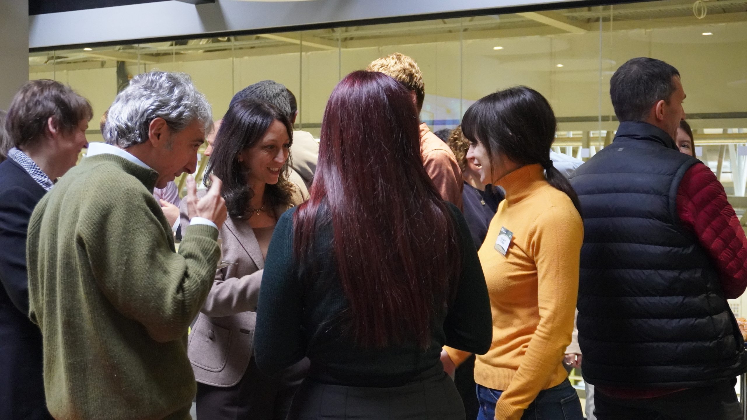 A group of people networking in a room while drinking coffee. Piergiuseppe Morone and Eleonora Staffieri are in the photo among other partners of the Rural BioReFarmeries project.