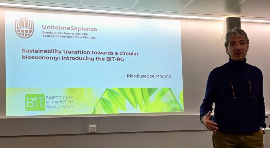 Piergiuseppe Morone during a lecture at UCL in London. The slide of the presentation behind is titled 'Sustainability transition towards a circular Bioeconomy: introducing the BiT-RG'